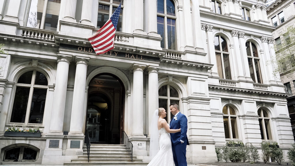 Couple smiling in front of the Old City Hall building in Boston