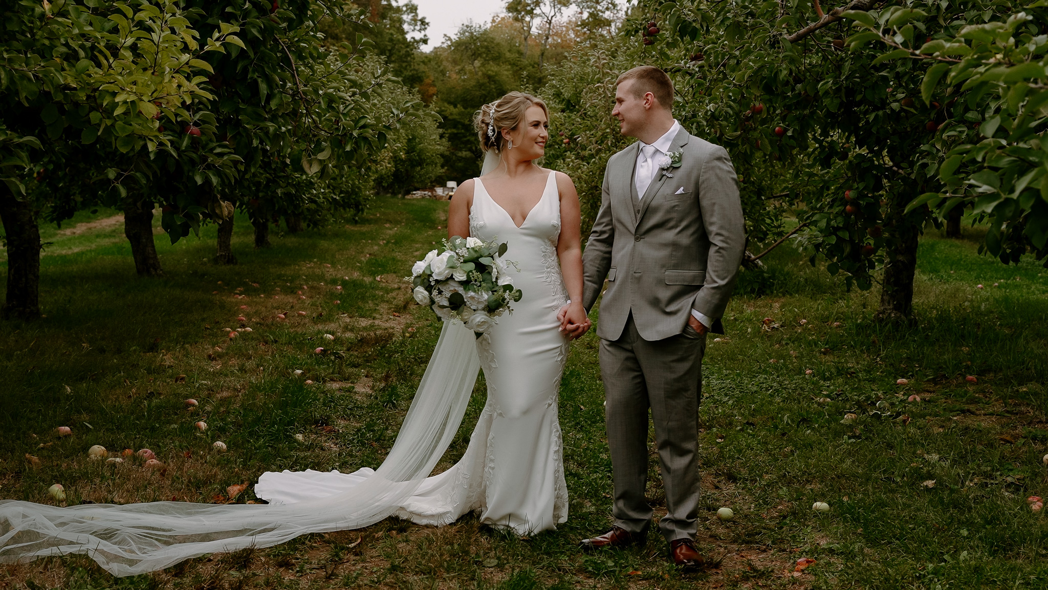 Wedding videographer and photographer capturing ceremony at outdoor New England venue
