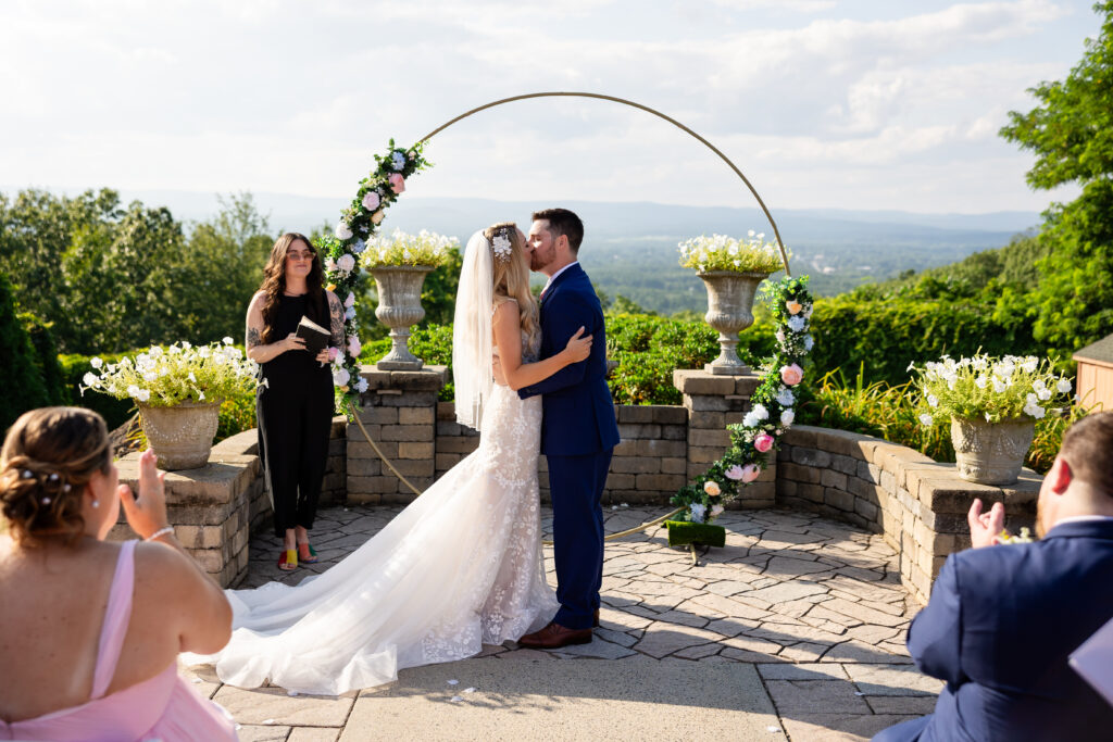 Bride and Groom Kissing at the alter